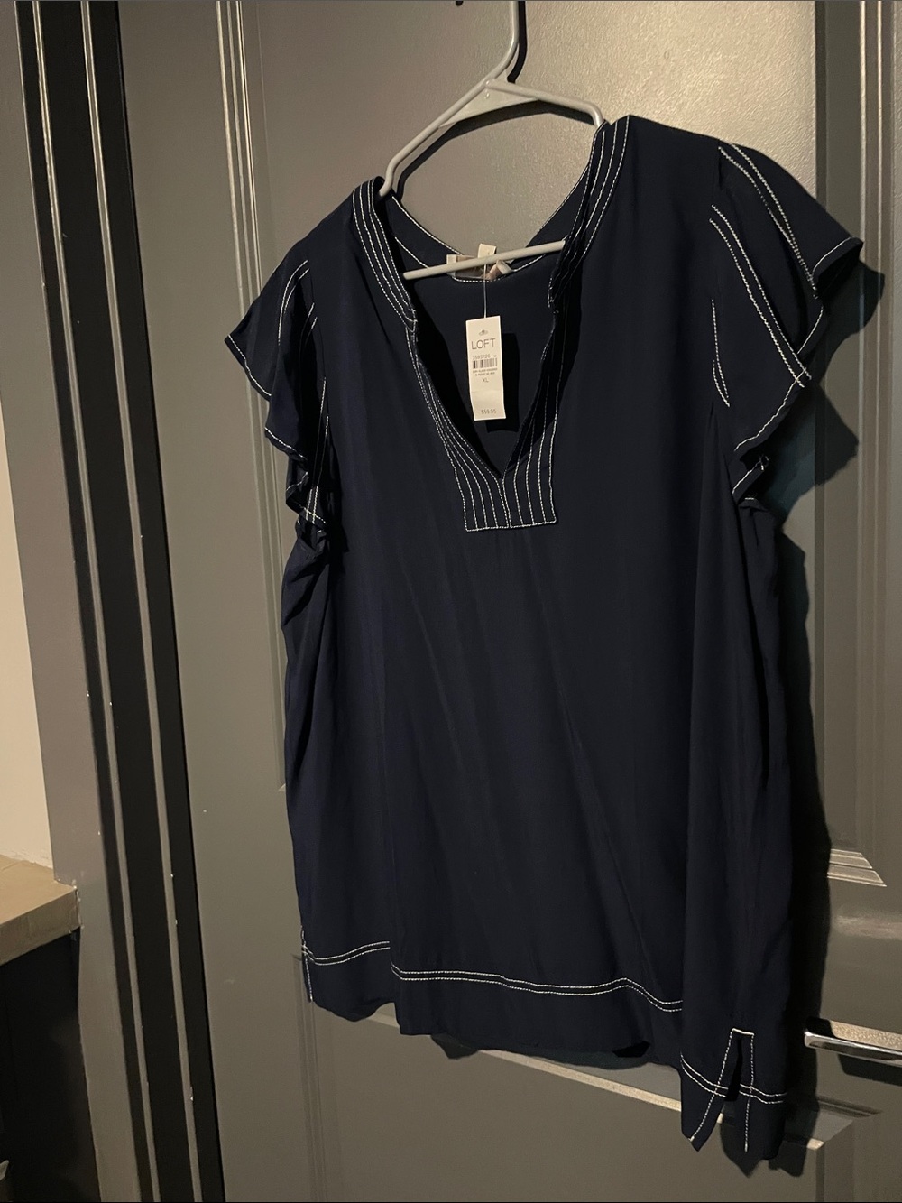 LOFT Navy V-Neck Flutter Sleeve blouse with White Stitching